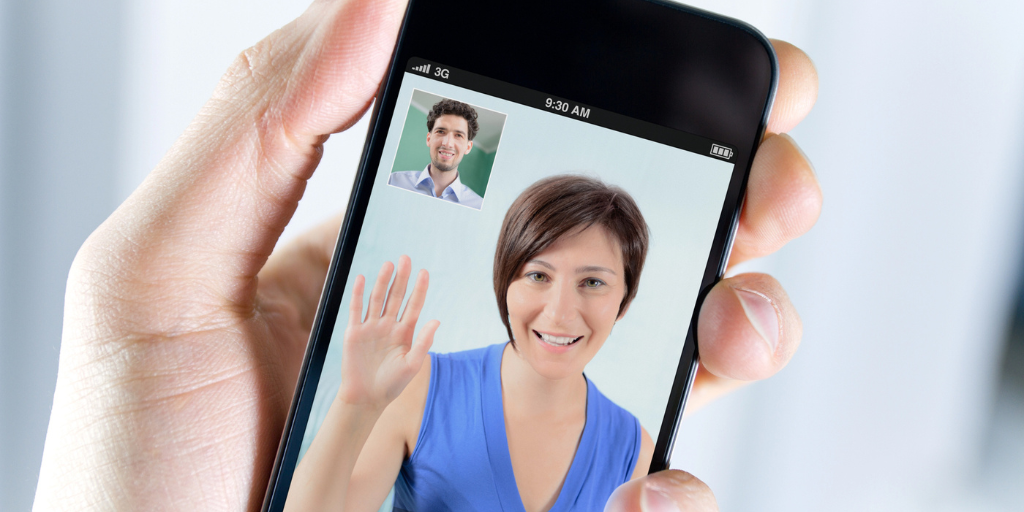 Close up view of a man having a video call with a woman on a smartphone